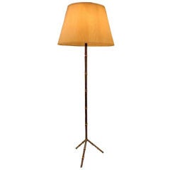 A Floor Lamp in Leather and Brass by Jacques Adnet