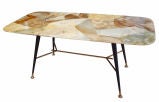 A Marble Topped Mid Century Cocktail Table in the style of Gio P