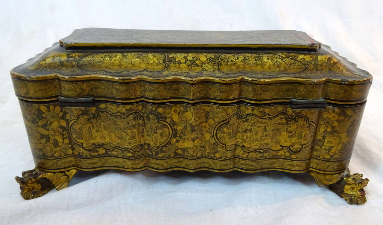 19th century Chinese glove box in ebonized finish with gilt detail, shaped edges and feet and removable interior tray.
