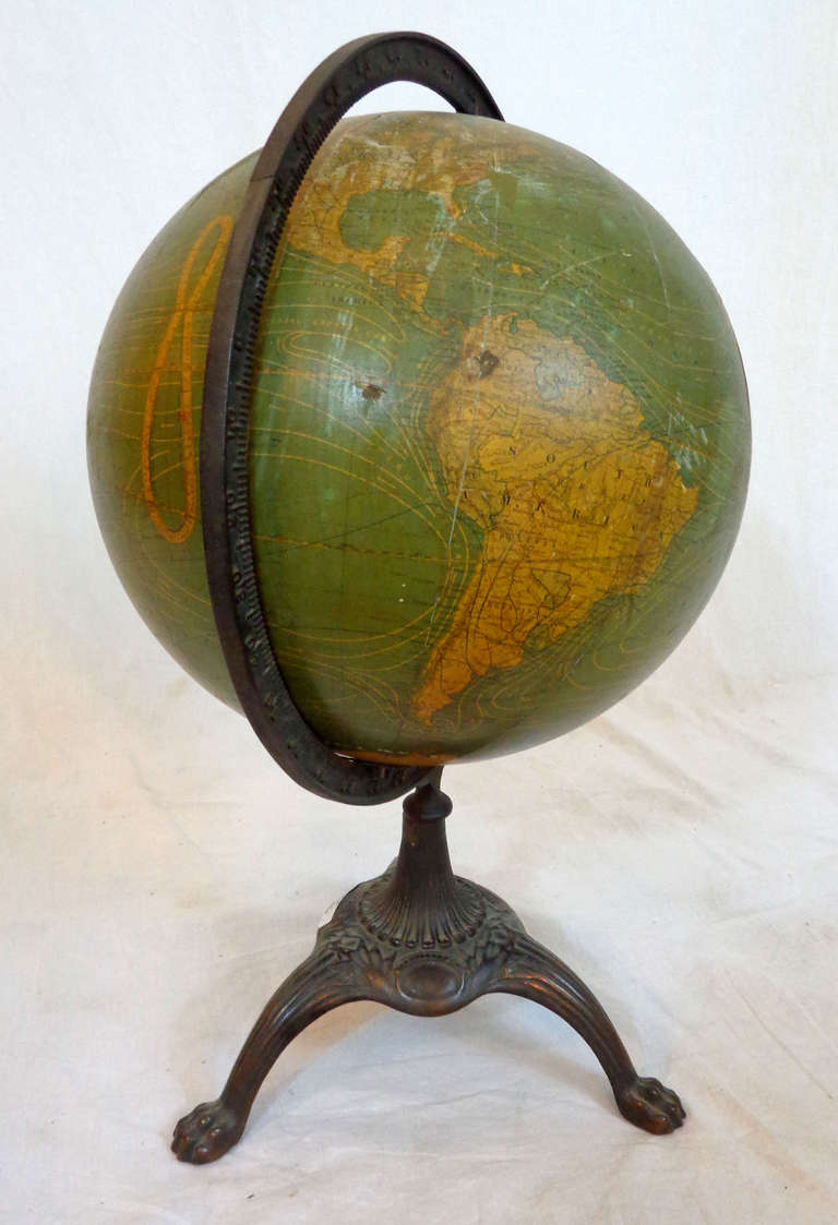 12-inch globe on three-footed brass base with a bronze finish by W. & A.K. Johnston, Ltd, Geographers; Engravers & Printers, Edinburgh and London.  Likely distributed through Chicago.
