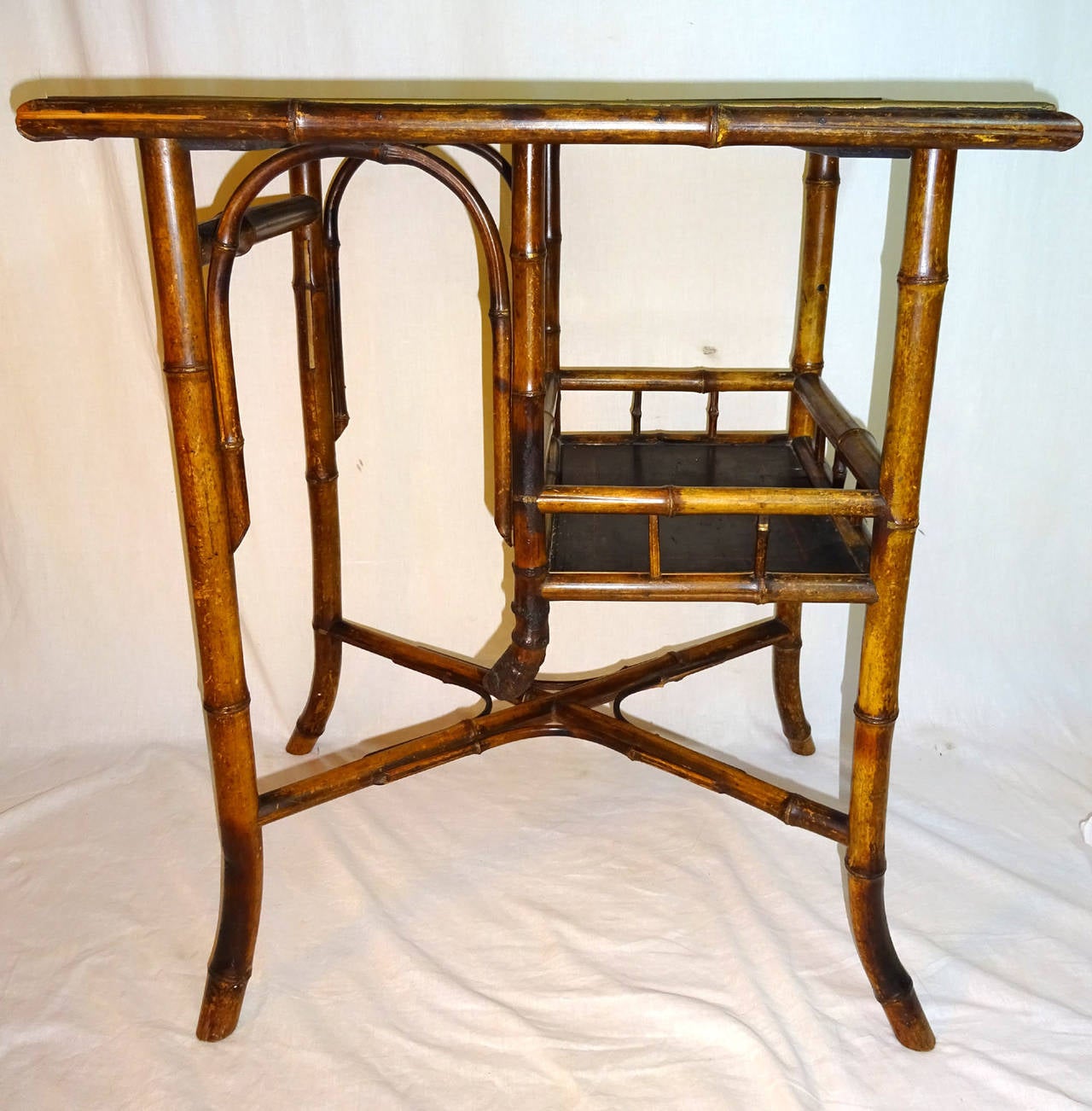Bamboo tea table with black chinoiserie lacquer top and lower half-shelf