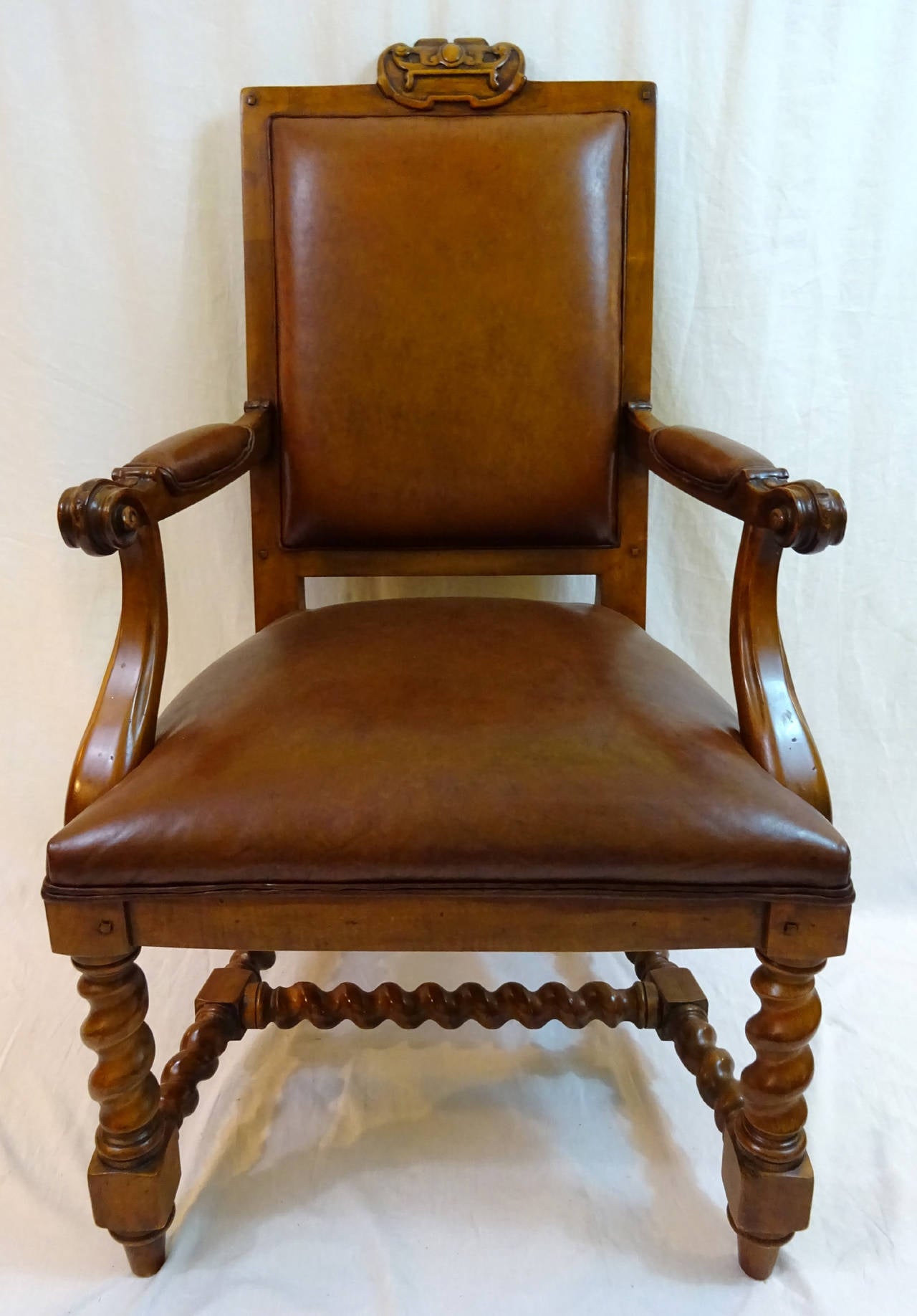 Set of six chairs by Ralph Lauren, two armchairs, four side chairs, upholstered in a distressed brown leather above barley twist legs and stretchers.