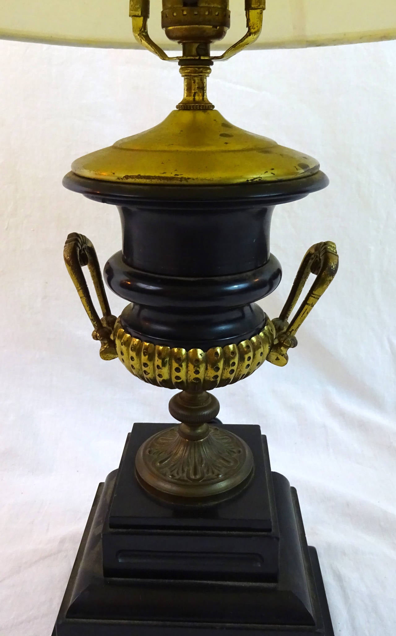 19th century spelter and bronze urn, now as a lamp on an ebonized base.
