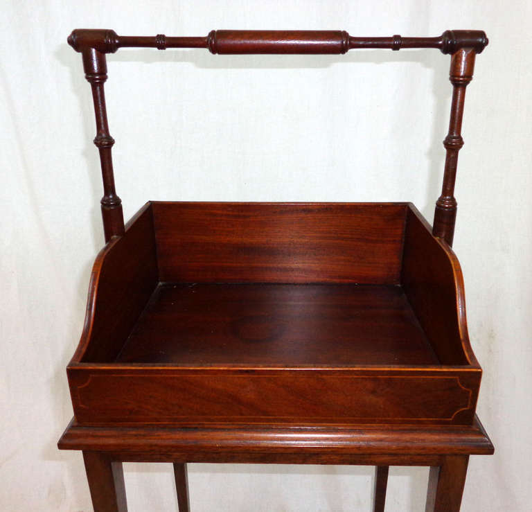 19th century English Regency mahogany book carrier now as a tray table on a later stand.