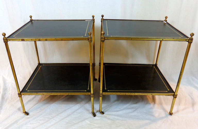 Pair of Regency Style Brass Side Tables with embossed leather surfaces sitting upon small casters, possibly from Malletts of London.