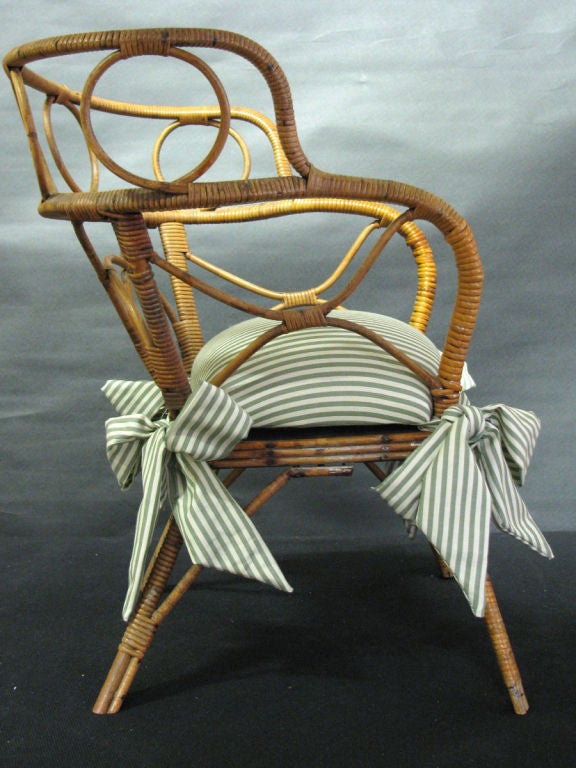 A Charming Child's Open Armed Bamboo Chair & most likely a toilet training chair. From the ex-collection of Mr. & Mrs. Martin Jurow.