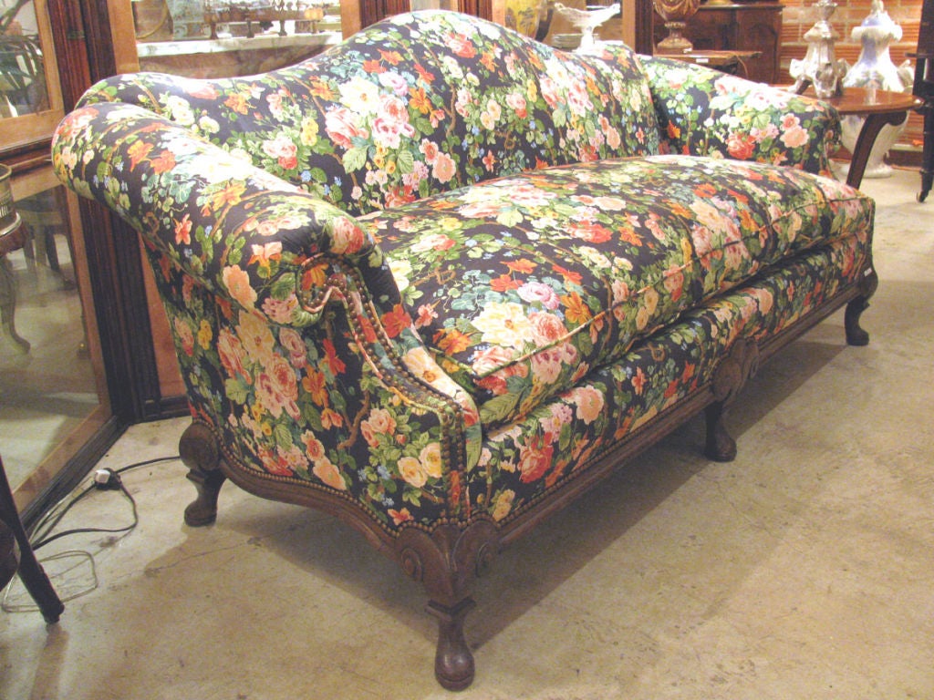 Queen Anne Style Walnut Sofa covered in Brunschwig & Fills floral chintz. A similar sofa of this design can be found in the library at Rough Point in Newport, RI, former residence of Doris Duke.