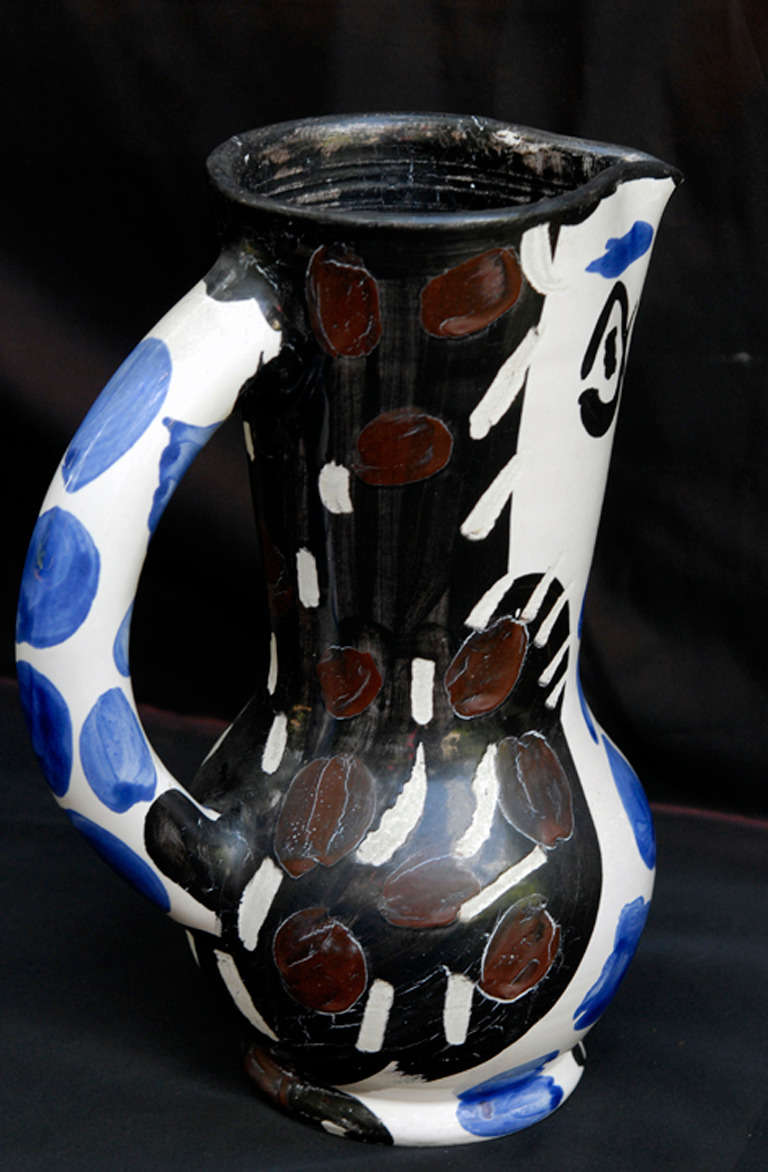 Ceramic vase, handpainted in black, blue and brown. Partly glazed for special effect. Edition of 500 ex. designed and made in 1955. 
With the inscription MADOURA PLEIN FEU/ EMPREINTE EDITION PICASSO (underneath, see pictures)

Reference : Ramie,