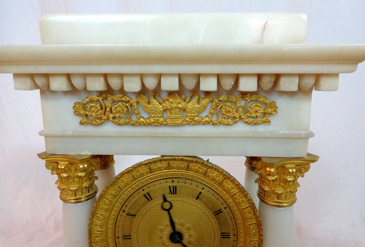 19th century French temple clock of Carrara marble with ormolu face and mounts.
