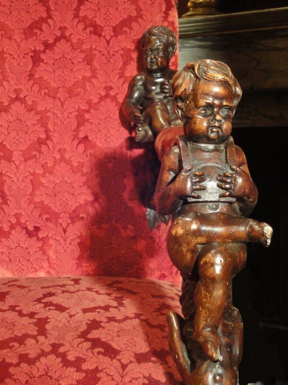 A Near Pair of Beautifully Carved Armchairs with Putti
