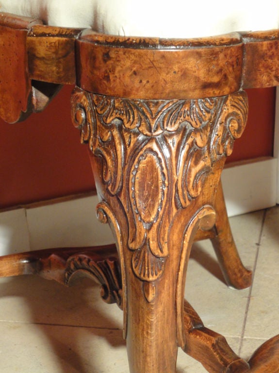A Pair of Dutch Side Chairs. The elegantly shaped & carved backs features beautifully burled splat rail & uprights. The shaped apron repeats the burl wood. The cabriole legs are beautifully carved at the knee & end with ball & claw feet. The shaped