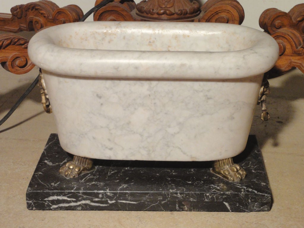 A Pair of White Marble Tubs on Black Marble Bases at 1stdibs