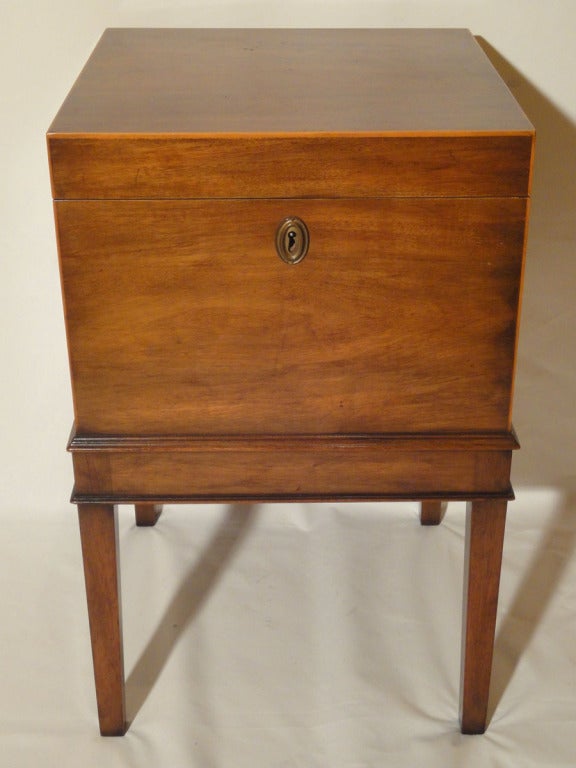 Kittinger George II Style Mahogany Cellarette with edges accented with boxwood stringing. Kittinger Furniture Company, established in 1866, 