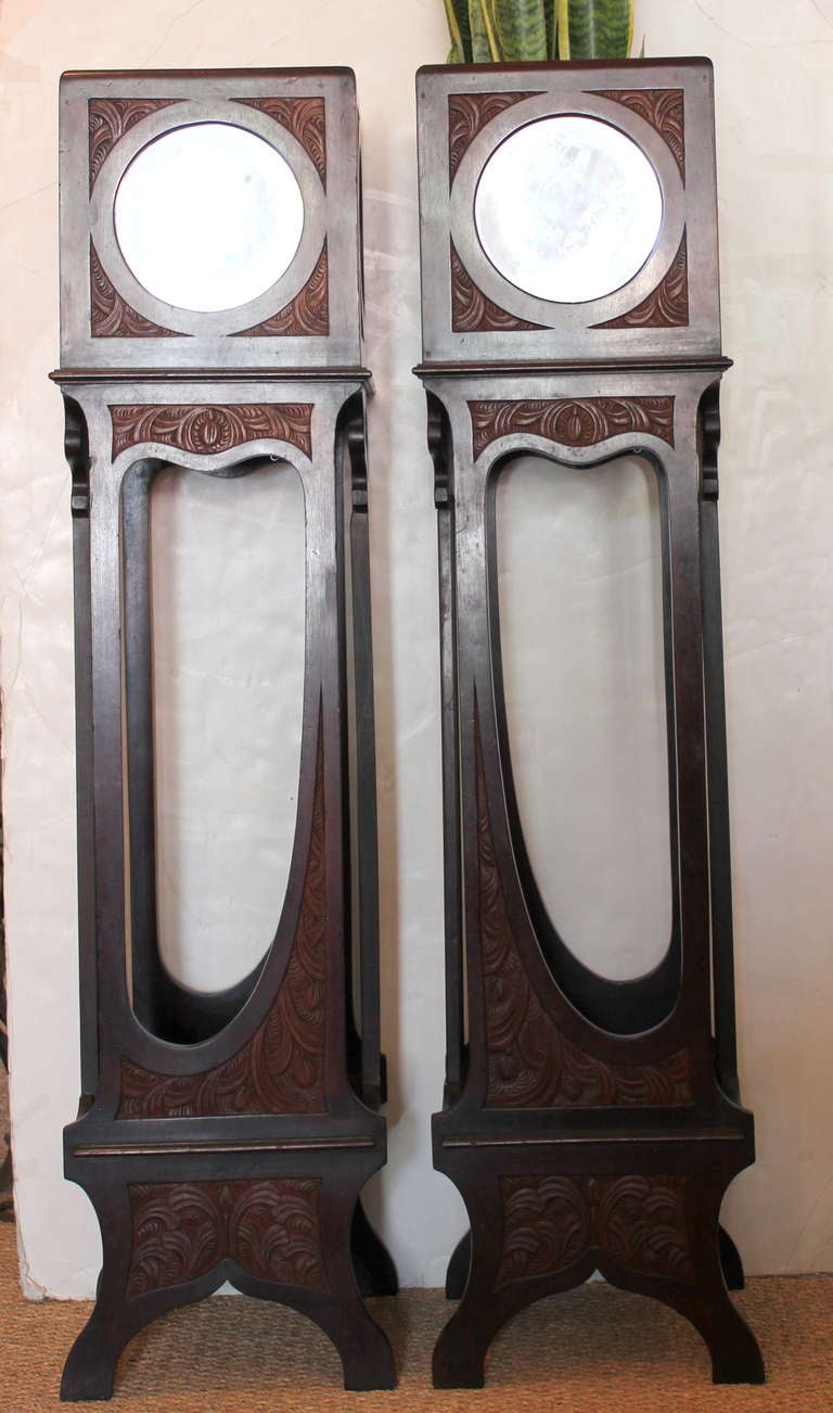Pair of 19th Century Mirrored Plant Stands.  Hand Beveled mirrors  in the front and green glass on the 3 sides.   Hand carved . 