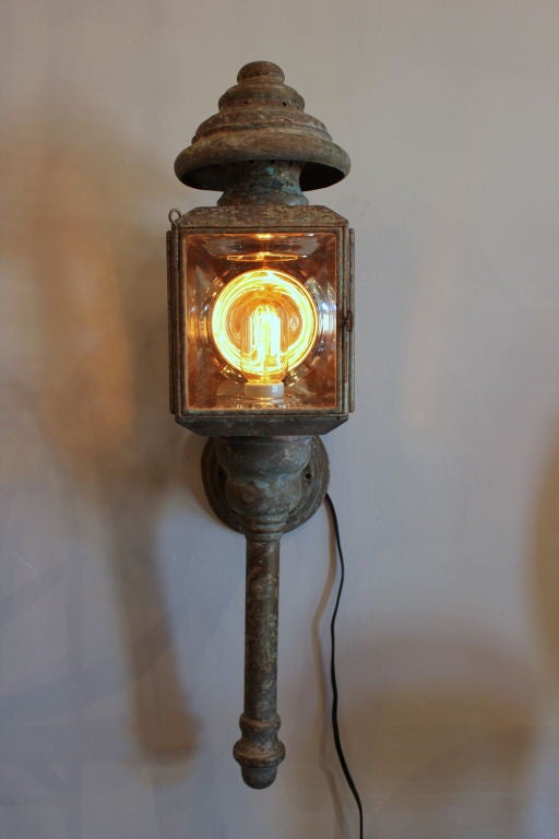 Pair of Brass Coach Lamps with Patina.  Interior back wall is polished metal.  Original Glass.  Rewired