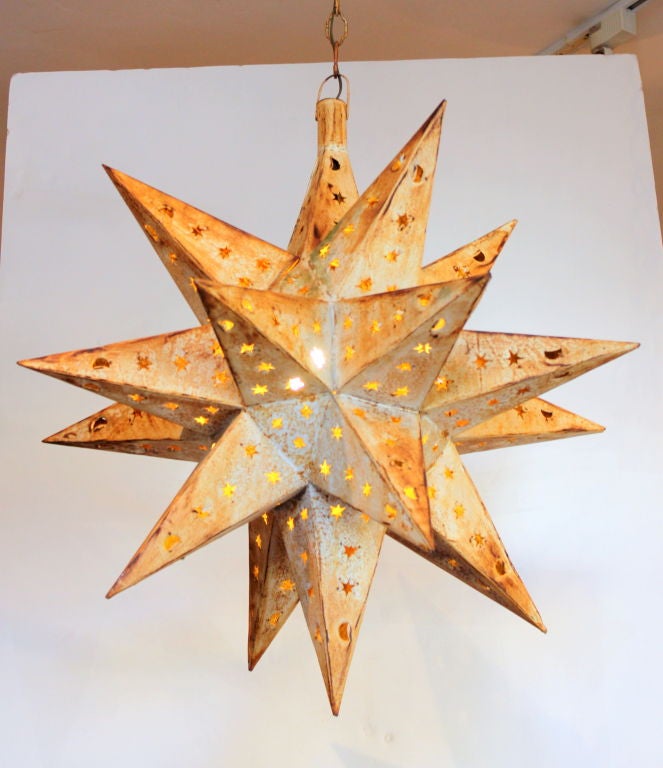Tole Star lantern perforated with small stars.