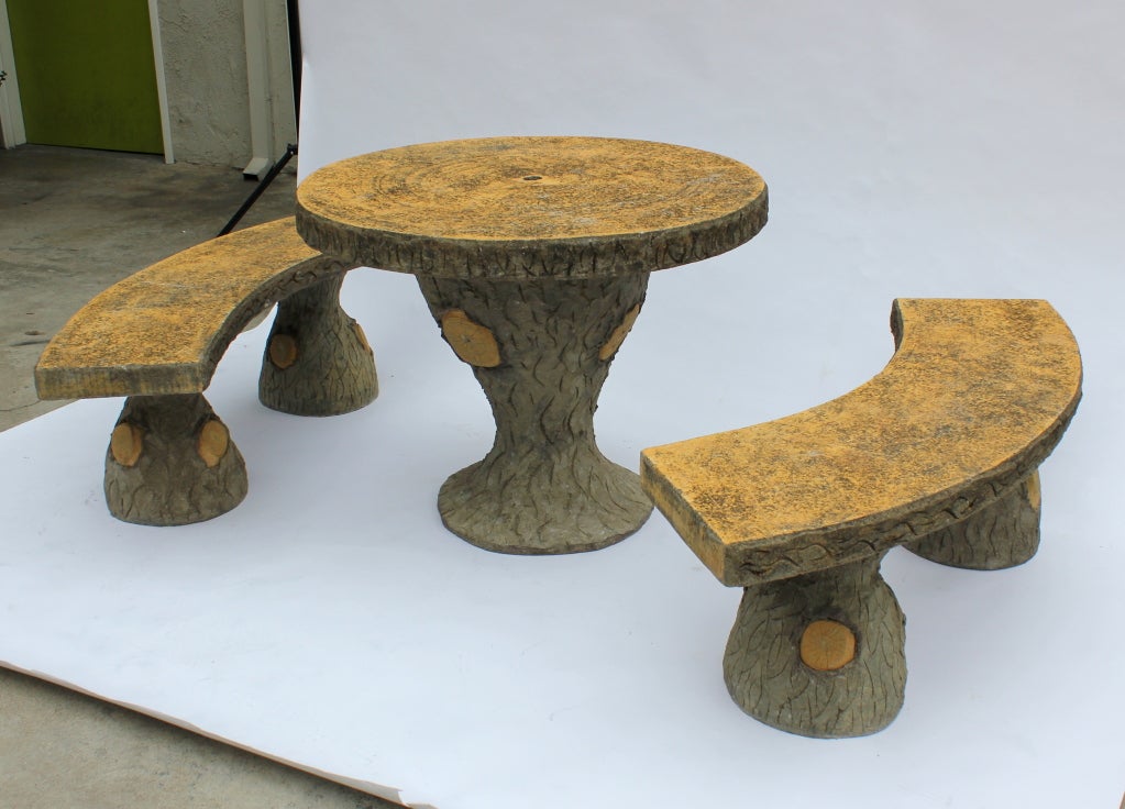 Great Cement Faux Bois Table and 2 benches.   We believe these to be 20 or so years old.  Show light use.  Top surface of table and benches are yellow.