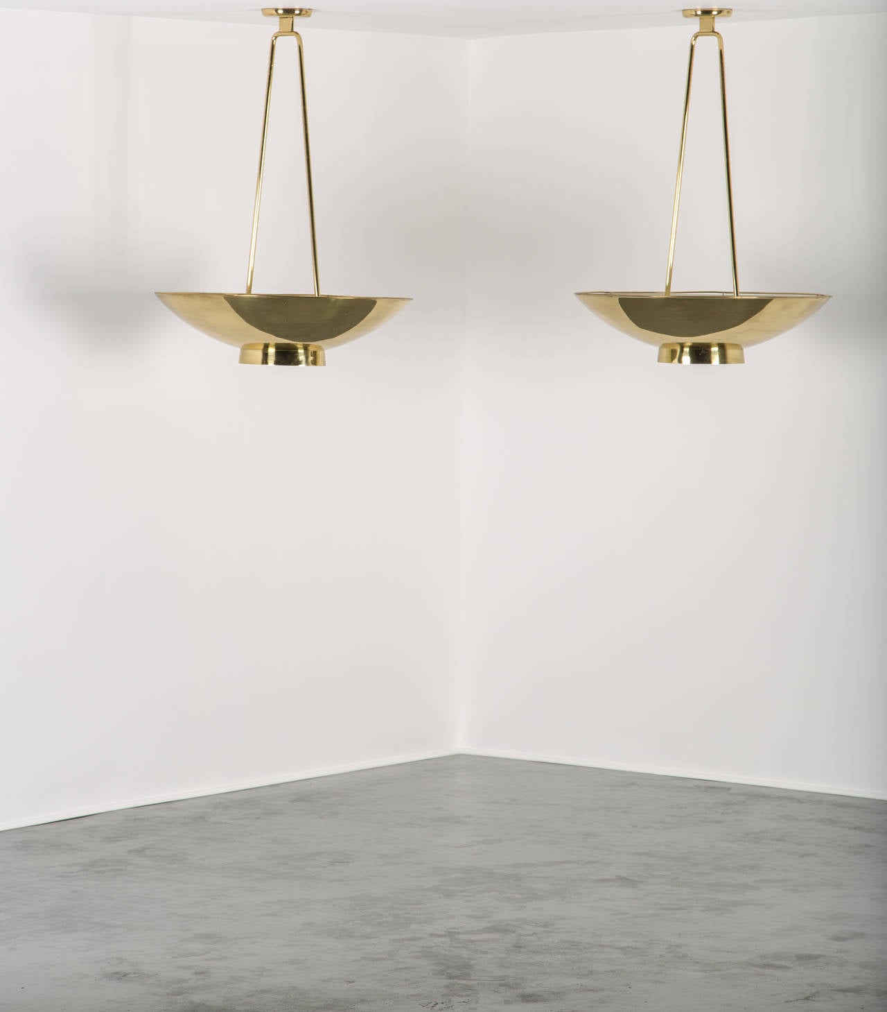 Paavo Tynell.

Pair of ceiling lights.

Taito Oy.
Finland, 1950s.
Brass, painted metal.
Measures: 40 1/2 in. (103 cm) drop, 30 1/2 in. (78 cm) diameter for each.
Manufactured by Taito Oy, Finland.

Rare pair of Paavo Tynell ceiling lights