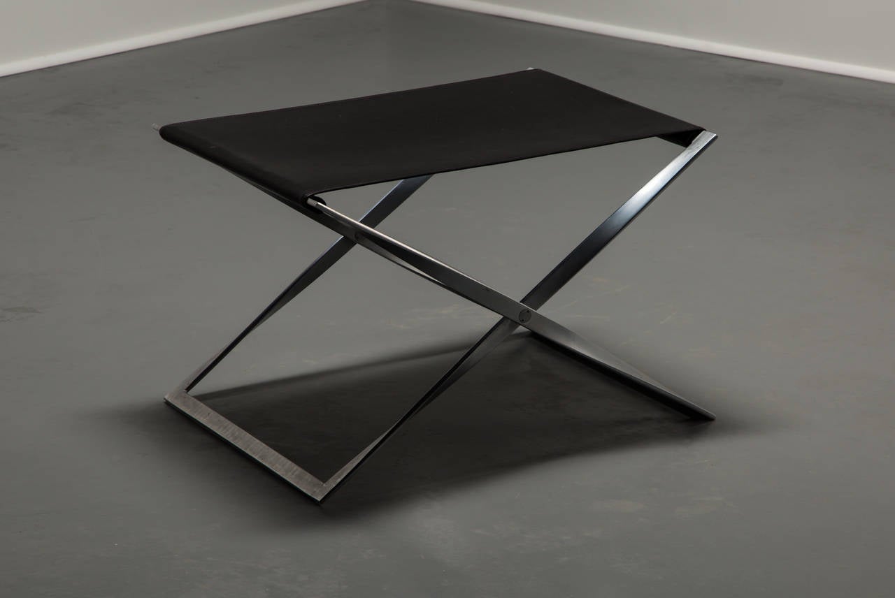 Poul Kjærholm.

Folding stool.

Fritz Hansen.
Denmark, circa 1962.
Plate steel, leather.
15 x 23.75 x 17.75 inches.

1980s production for Fritz Hansen.