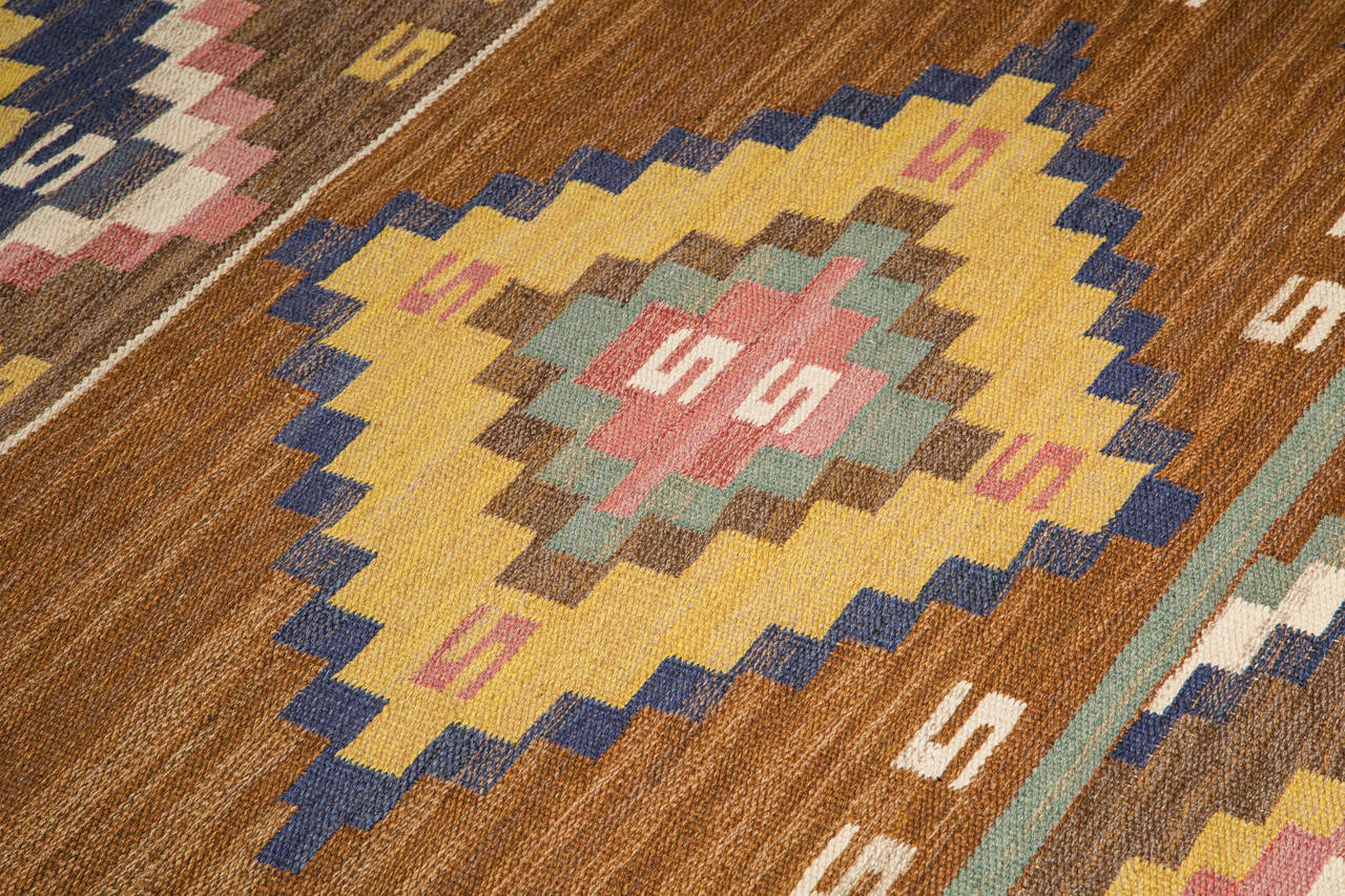 Märta Måås-Fjetterström Flat-weave carpet.

Marta Maas-Fjetterström, Sweden, 1930s.

Handwoven wool.
Measures: 315 x 185 centimeters.

Woven signature to edge: MMF. (Signature means piece was executed before 1942).