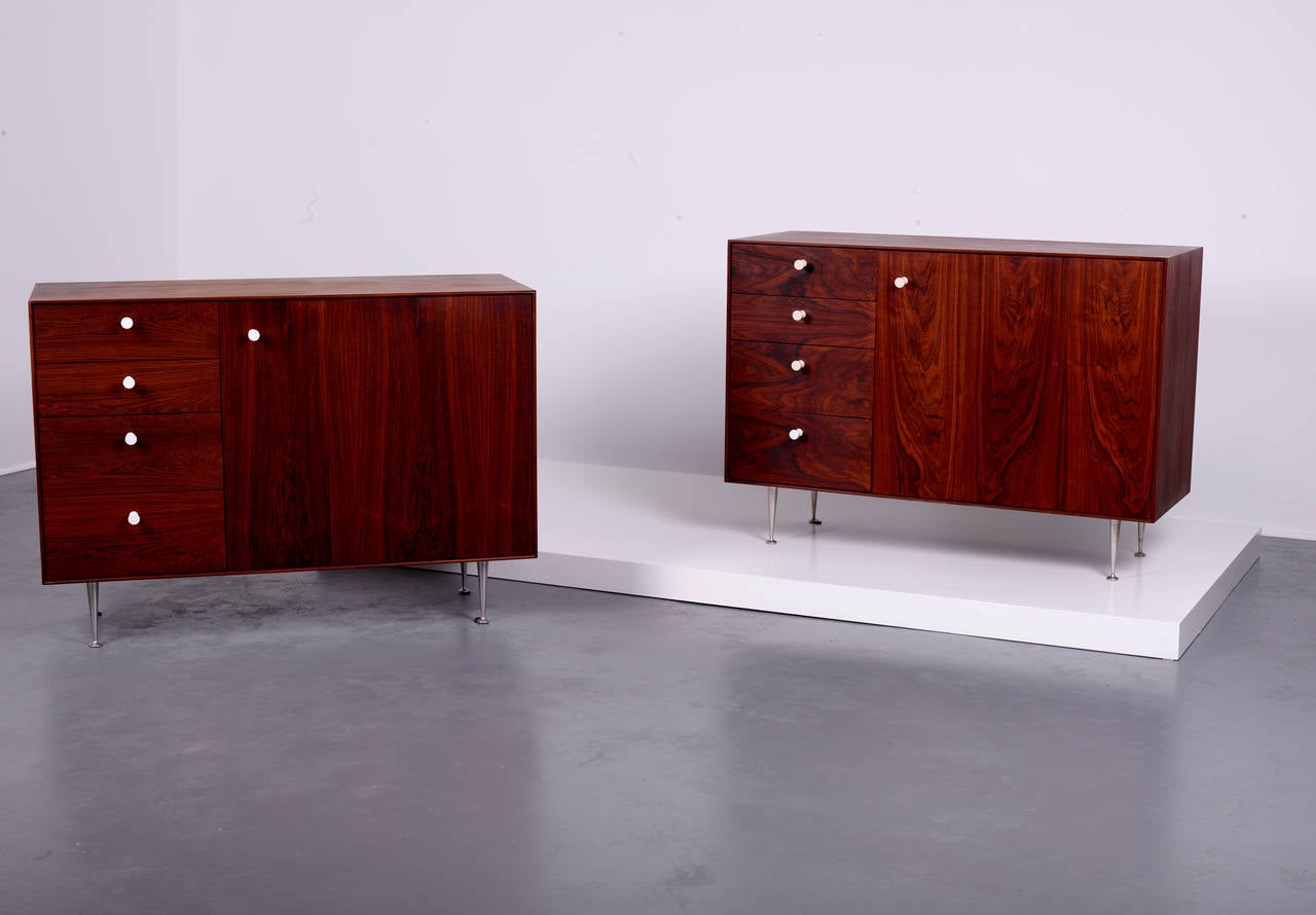 George Nelson & Associates.

Thin edge cabinets (pair).

Herman Miller,
USA, 1952.
Rosewood, aluminum, porcelain.
Measures: 47 W x 18.5 D x 33.5 H inches.

Each cabinet has a finished rosewood back.