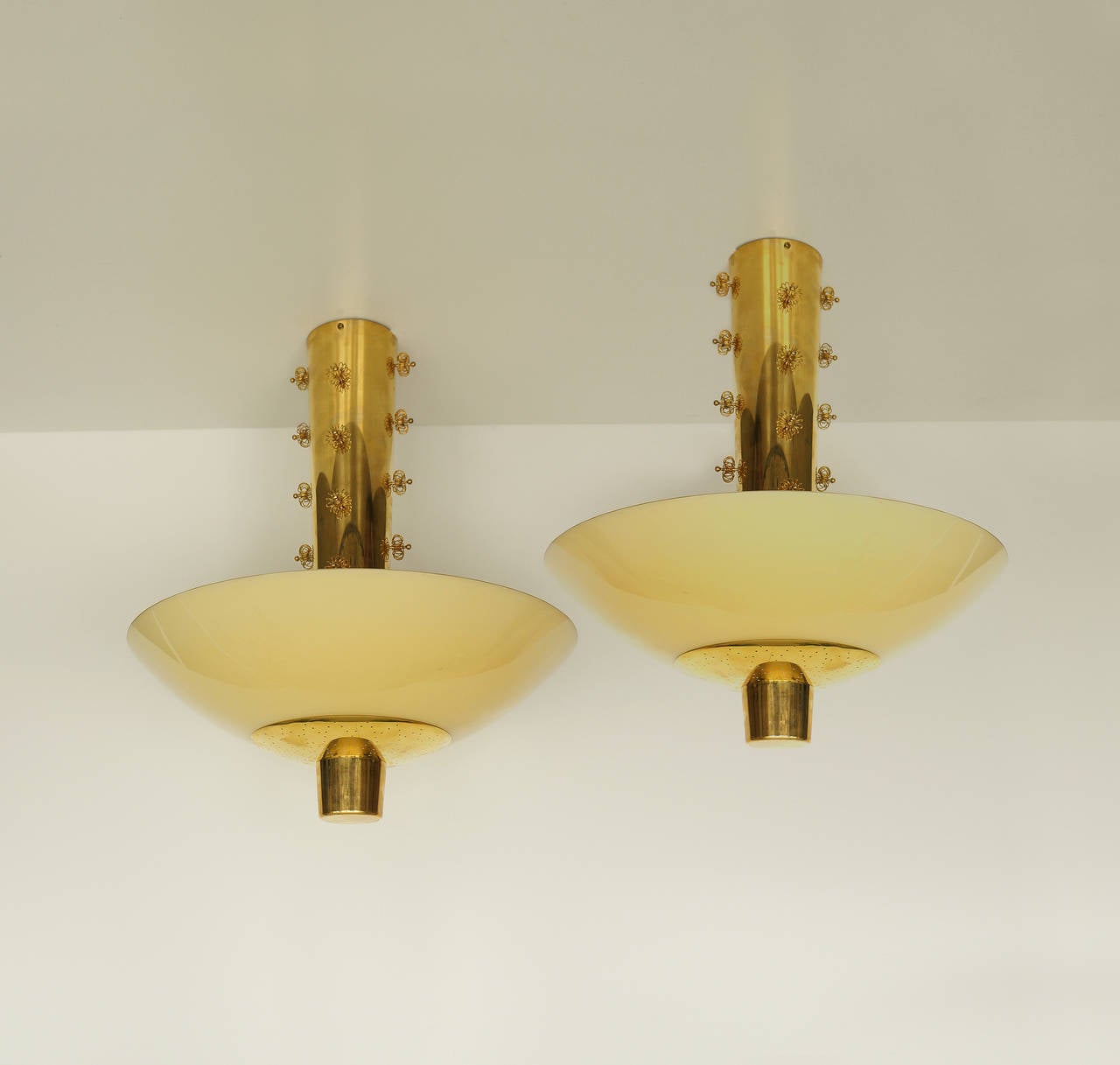 Paavo Tynell.

ceiling lights, (pair).

Taito Oy,
Finland, circa late 1940s.
Brass and mouth blown glass.
Measures: Height 62 cm x diameter 53 cm.

A rare pair of large ceiling lights by Paavo Tynell, late 1940s. Originally made by order