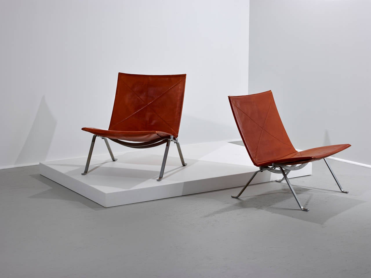 Poul Kjaerholm, PK 22 lounge chairs.

E. Kold Christensen.
Denmark, 1956.

Leather, chrome-plated steel.
Measures: 24.75 W x 27 D x 27 H inches.

Signed with manufacturer's mark to each chair, original leather.