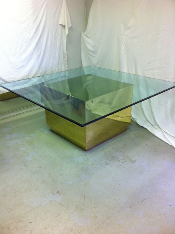 Opulent.  <br />
This has got to be the ultimate 1970's dining table.  Base is a gleaming cube of polished brass resting on a matching plinth base. Top is SIX FEET square, allowing this exquisite table to seat 12 easily.<br />
The base measures 36