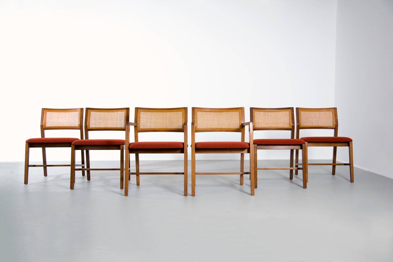 Edward Wormley for Dunbar model #431 dining chairs. 

Four side chairs, two armchairs. 

USA, 1960s

Re-caned and upholstered. 

Signed with rectangular metal label to underside.