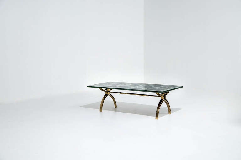 Dubé (Duilio Bernabe) coffee table.

Fontana Arte,
Italy, circa 1955.
Reverse-painted crystal, brass.
Dimensions: 42 W x 21 D x 15 H inches.

Rare 