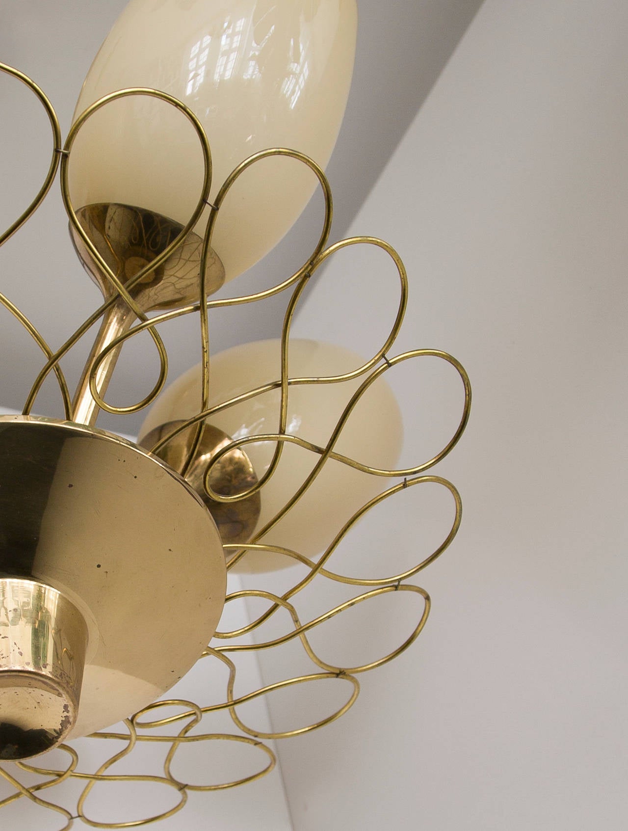 Paavo Tynell,

ceiling lamp,

Taito Oy, Finland, early 1950s.
Brass, opaline glass and painted metal.
Measures: Height, circa 65 cm, diameter, circa 46 cm. Height could be adjusted higher on request.

Very good original condition with patina.