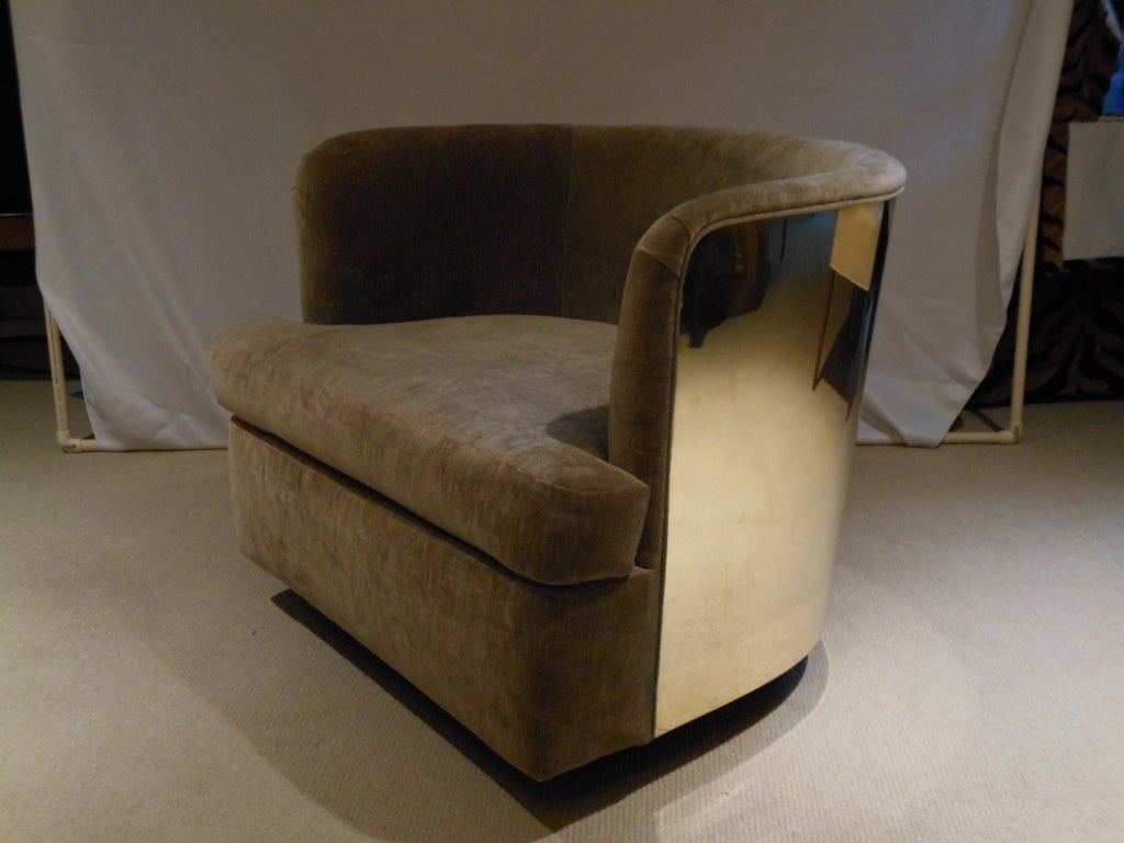 Incredibly rare pair of Milo Baughman for Thayer Coggin swivel chairs with gleaming mirror-finish brass backs and bases. 

Seats are deep and comfortable. Chairs swivel 360 degrees, and also rock.
Newly upholstered in taupe cotton/rayon