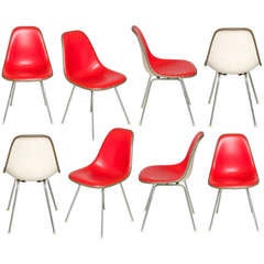 Eight Charles Eames Herman Miller Red Vinyl Side Shell Chairs