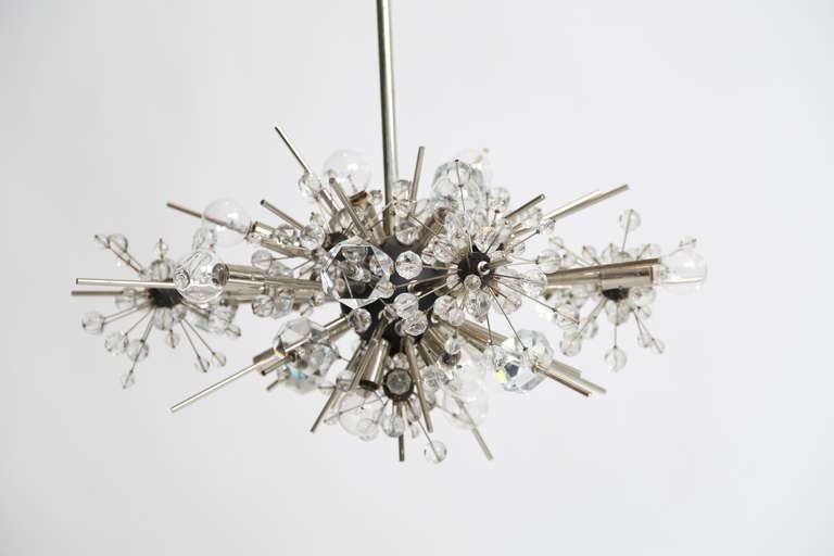 The Metropolitan Chandelier was designed by Hans Harald Rath for the Metropolitan Opera in New York.  Signed

Met Foyer
Hans Harald Rath 1963 
Modern

Nickel plated Brass 
dia/w: 33