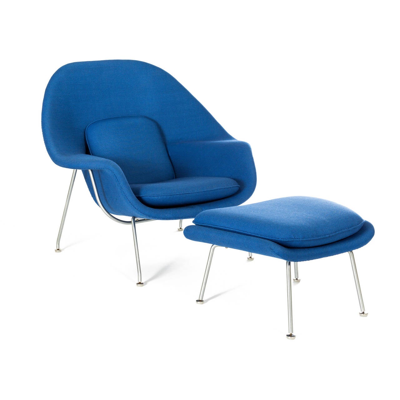 Eero Saarinen.

Womb chair and ottoman upholstered in Alexander Girard fabric.

Knoll.
USA, 1946.
Upholstery and plated steel.
39 w x 34 d x 36 h inches.