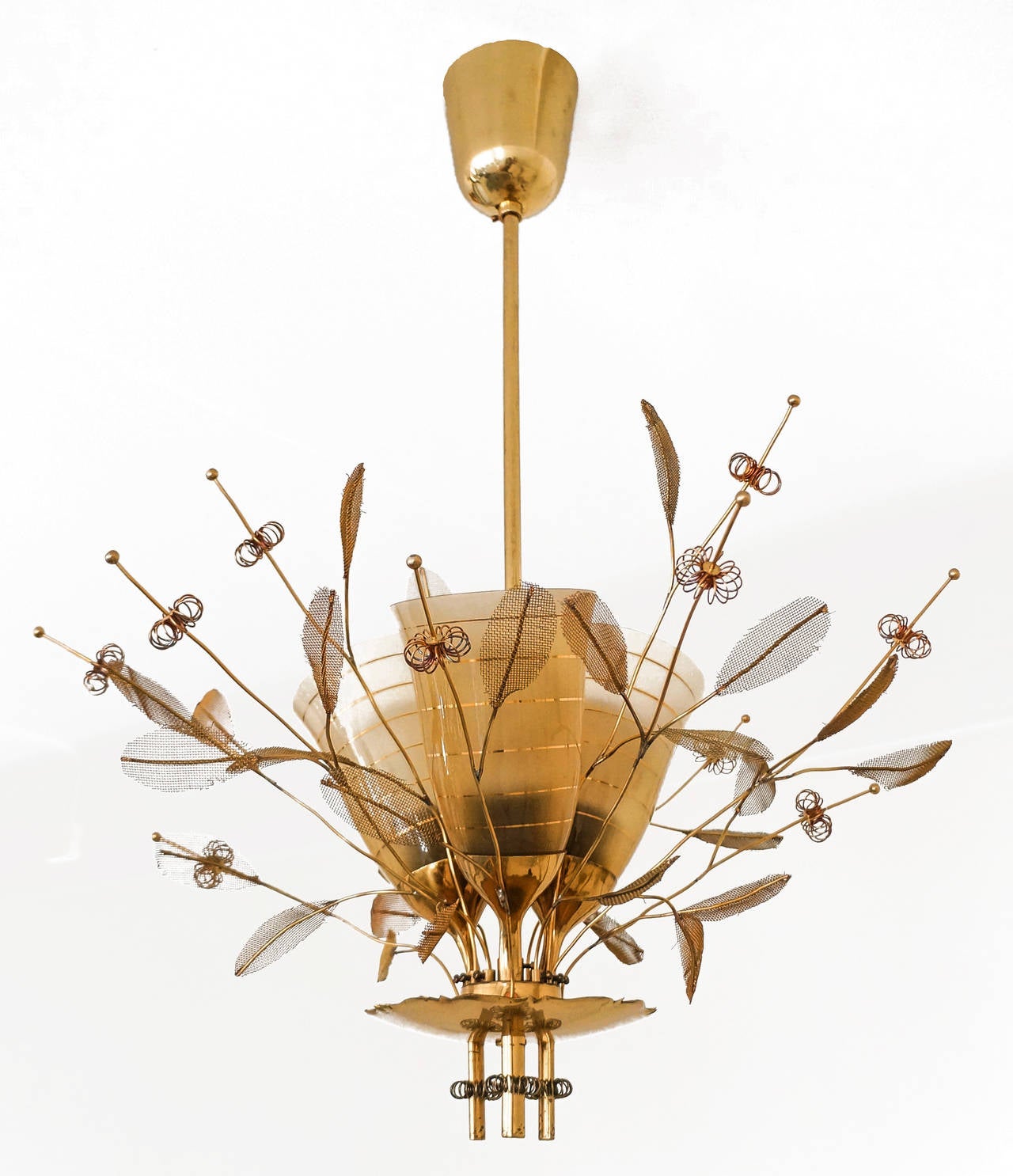 Paavo Tynell.

Ceiling lamp, model nr. 9029 / 3.

Oy Taito Ab,
late 1940s-early 1950s, Helsinki, Finland.

Solid brass, metal, metal mesh, glass.
Measures: Height circa 70.0 cm x width circa 50 cm.

Original custom ordered gold gilded glass shade