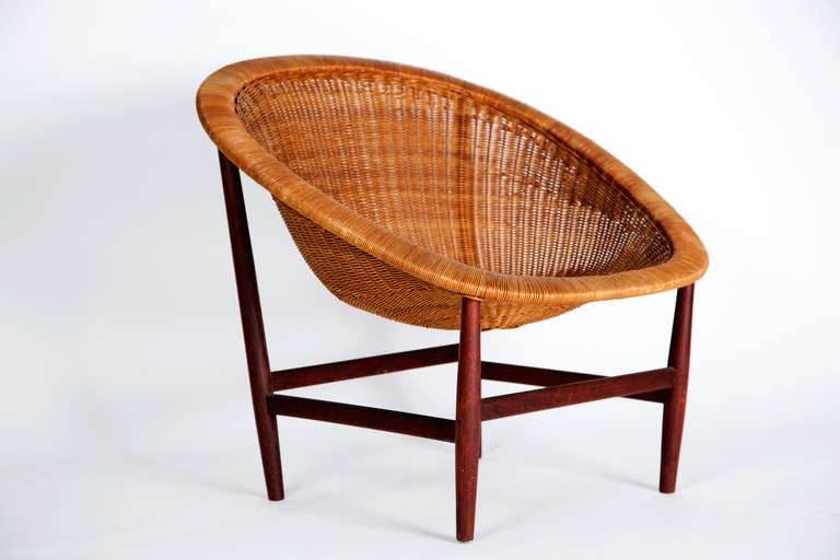 Nanna Ditzel basket chair.  Design date, 1950.

Maker: Ludvig Pontoppidan

Wicker with teak frame.

dimensions 
WIDTH:	32 in. (81 cm)
DEPTH:	29 in. (74 cm)
HEIGHT:	29 in. (74 cm)
SEAT HEIGHT:	15 in. (38 cm)

Repair to the right front