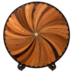 An Anglo-Indian carved and inlaid circular center table.