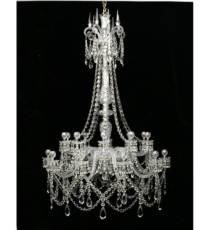 A highly important 20 light cut-glass chandelier by F&C Osler, with shepherd crooks surmounted by spires crowning the diamond cut baluster shaft, over twenty candle arms arranged on two levels. The chandelier richly draped with flat back spangles