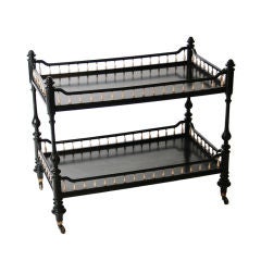 A Victorian ebonized and ivory balustraded two-tier trolley.