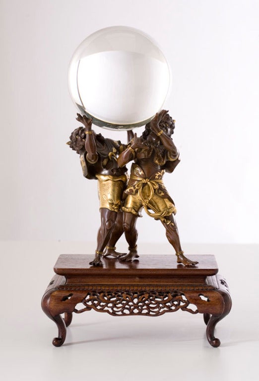 A Japanese Meiji period bronze model of two Oni.