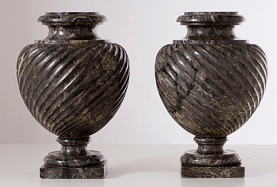 A pair of Roman strigilated bulbous 'Bigio Morato' marble vases.  Bigio Morato is a fine-grained gray marble, much favored during the 2nd century A.D., especially during the reign of the Emperor Hadrian