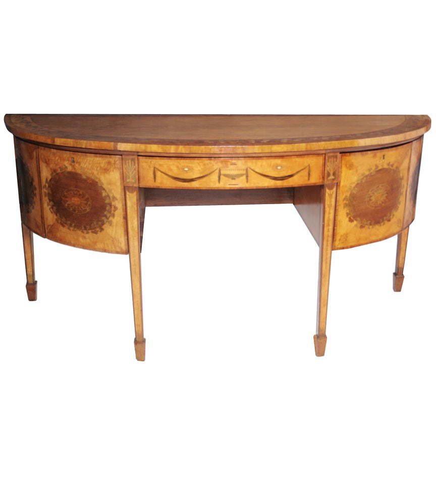 A  George III satinwood, mahogany and marquetry demi-lune sideboard. For Sale