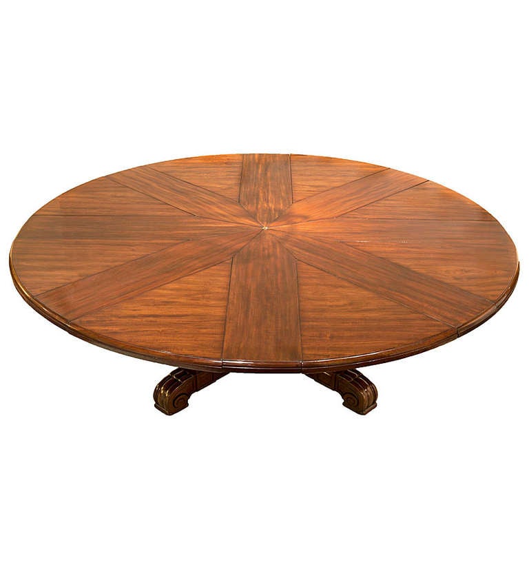 A William IV mahogany circular extension dining table from Johnson & Jeanes, bearing an inscribed brass maker's plaque.  The finely figured top of radiating sections, and with two sets of leaves, creating 3 diameters.  Johnson & Jeanes succeeded