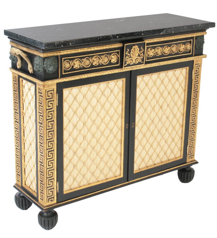 An elaborate Regency painted chiffonier with marble top.