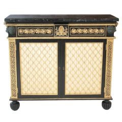 An elaborate Regency painted chiffonier with marble top.
