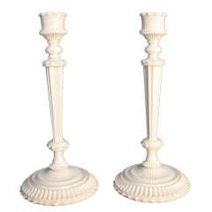 Antique A pair of Anglo-Indian carved ivory candlesticks.