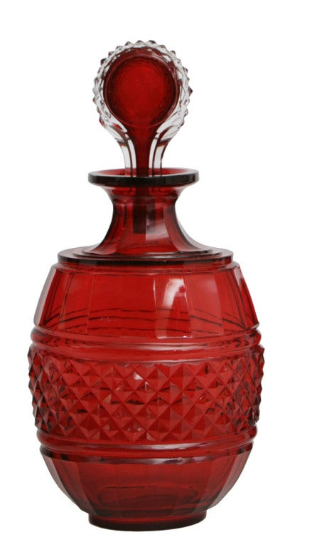 English A pair of red glass decanters. For Sale