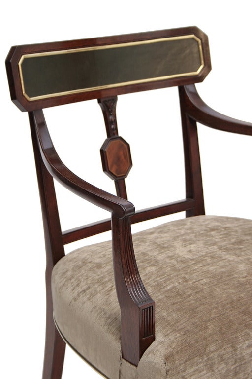 A set of 14 Sheraton mahogany dining chairs.