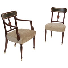 A set of 14 Sheraton mahogany dining chairs.